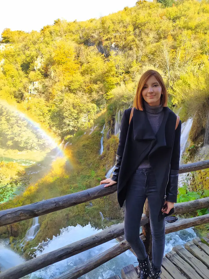 girl at plitvice lakes waterfall