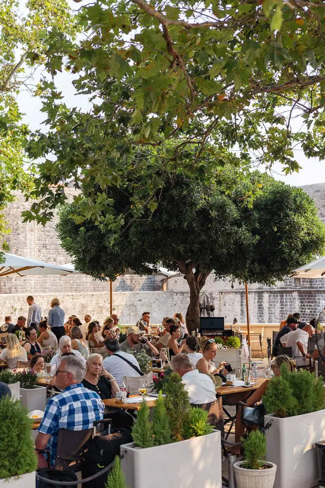 Outdoor dining with many patrons