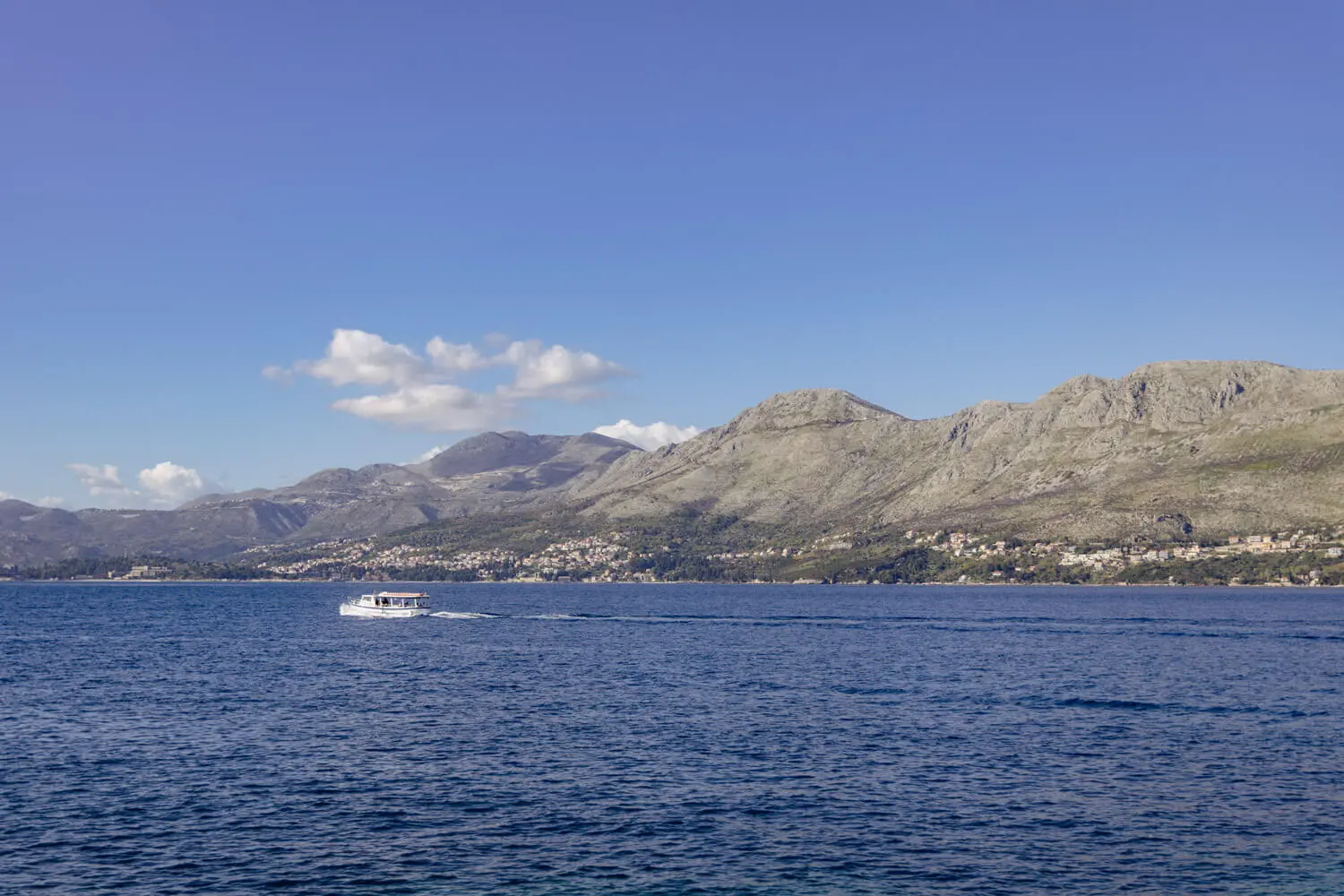 Boat on calm blue water