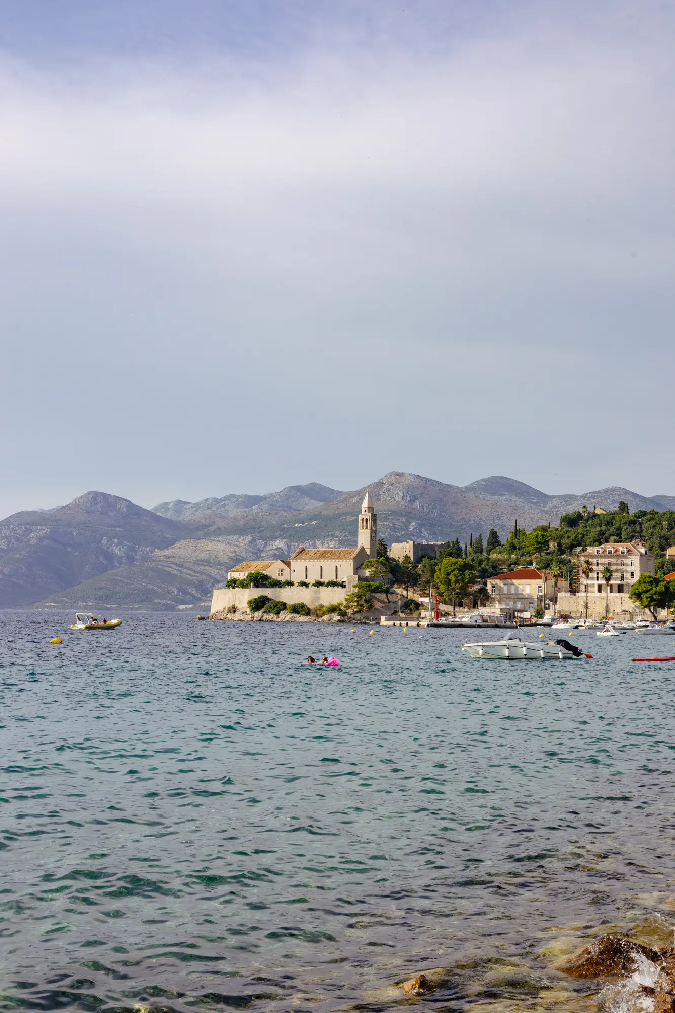 Lopud coastal village with mountains backdrop