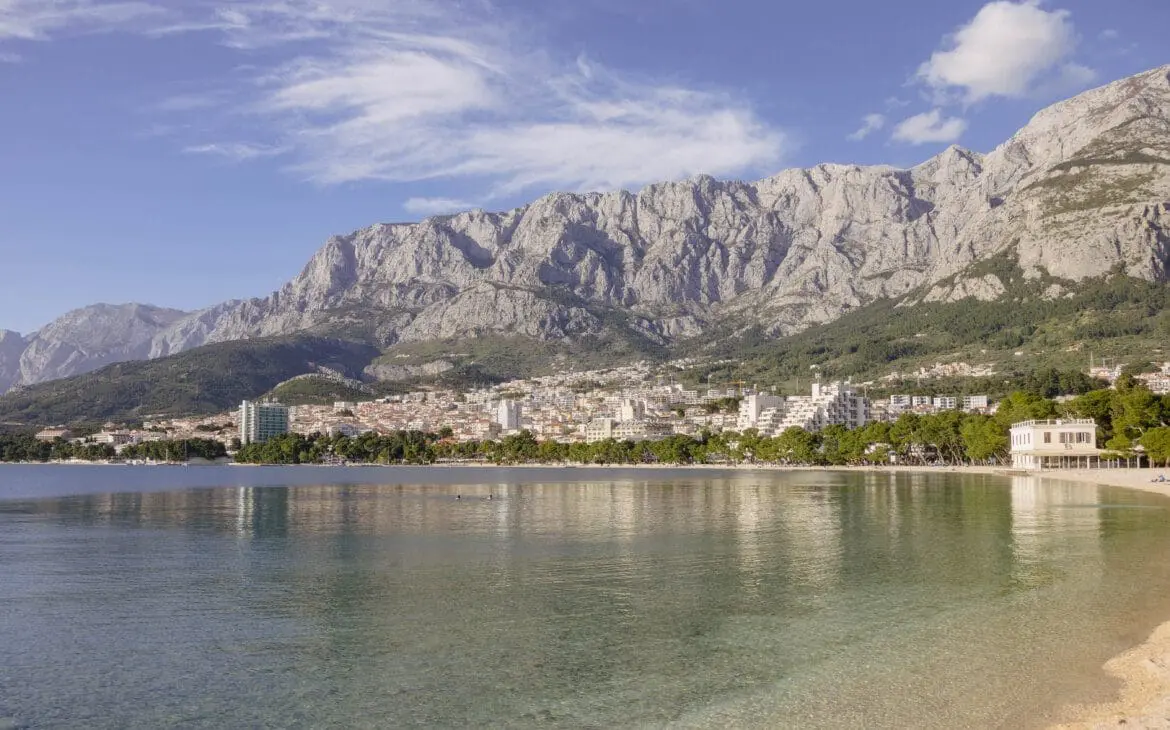 Coastal view with mountains and city