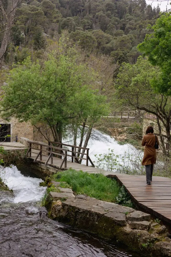 Person by a flowing river
