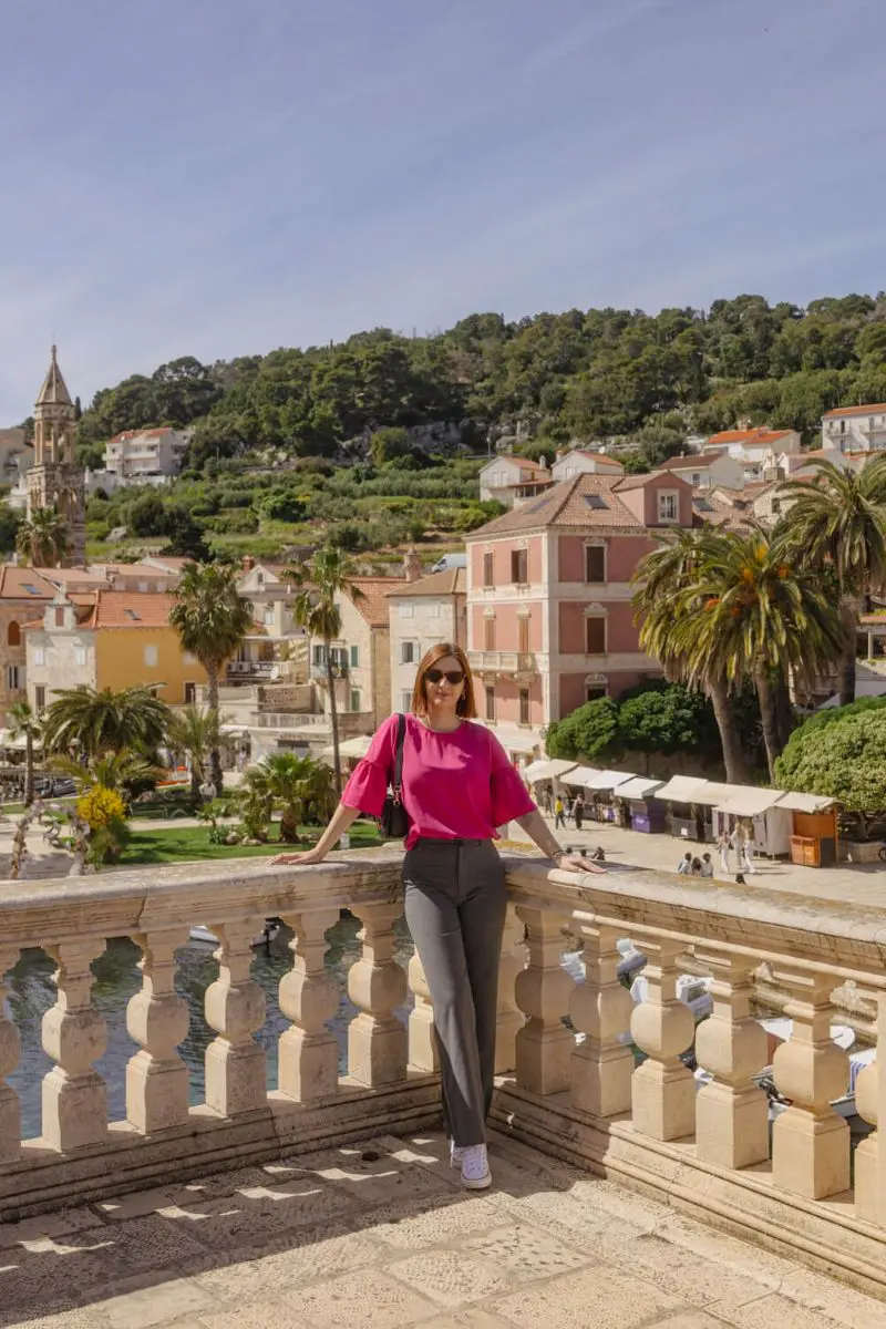 Person posing with scenic background.